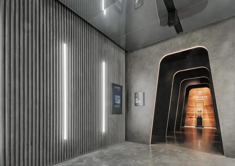 Entrada al Museo Legends con iluminación lineal LED minimalista y pasillo retroiluminado.